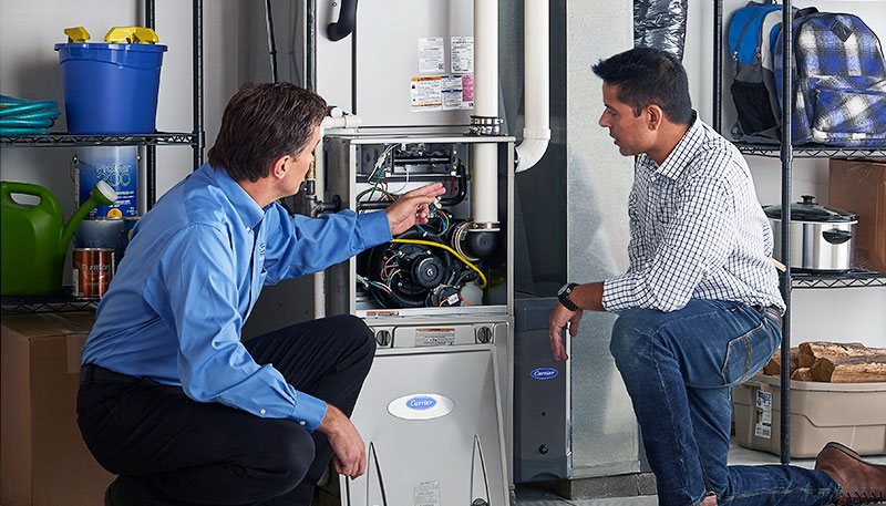 HVAC technician evaluating a furnace for repair or replacement in Sun City