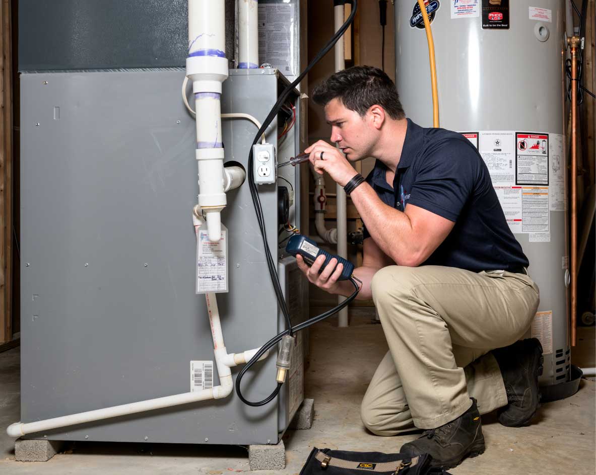 HVAC technician performing a furnace tune-up in Sun City