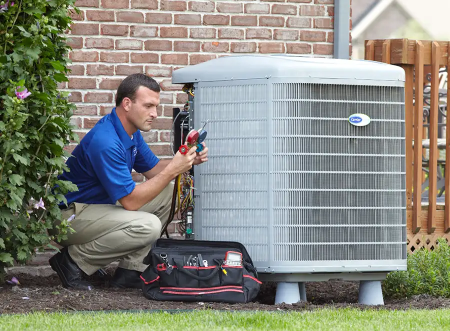 HVAC technician inspecting an outdoor air conditioning unit in Sun City